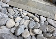 garden decoration with stones, natural stone at the garden, big pebbles, pebbles large